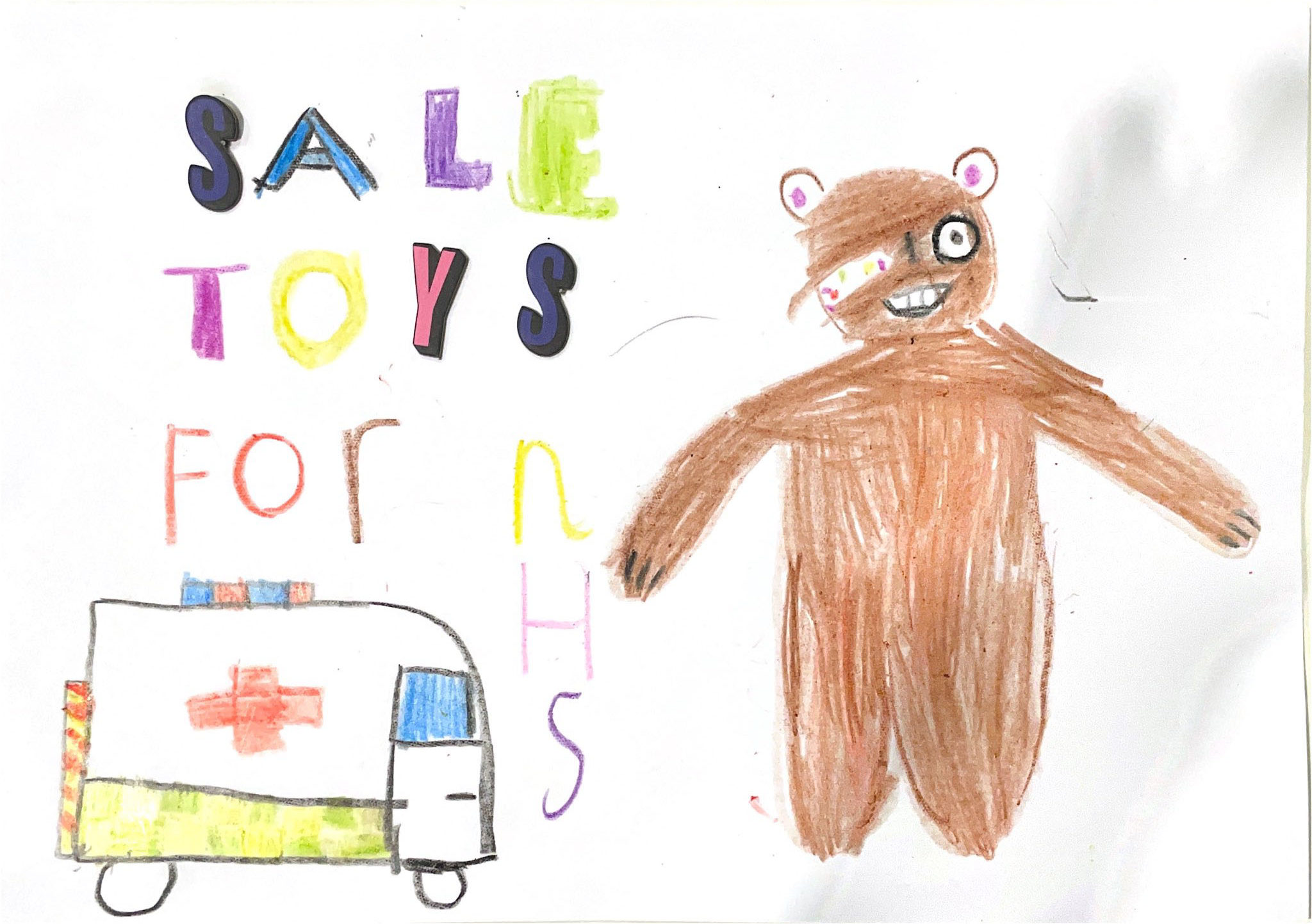 A colourful poster on a white background features the text "Sale Toys For NHS" in bubble font, with each letter filled in a different vibrant colour. On the right side is a large drawing of a brown bear with a band-aid on its face. In the bottom left corner, an ambulance is depicted driving towards the bear, complete with a red cross sign and red and blue lights on top. The poster suggests a toy sale to raise funds for the NHS.