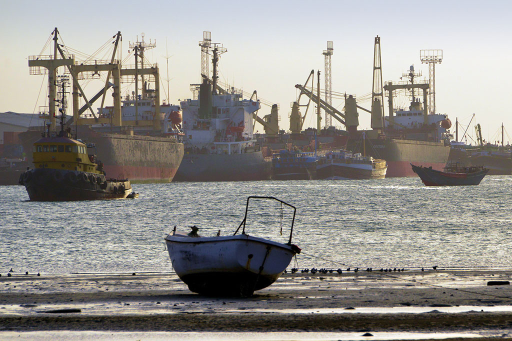 berbera port. Image taken from the beach with shipping in the background at sea
